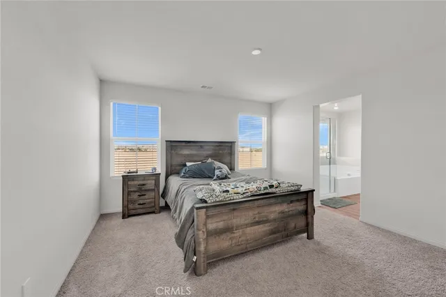 a bathroom with a shower sink and mirror