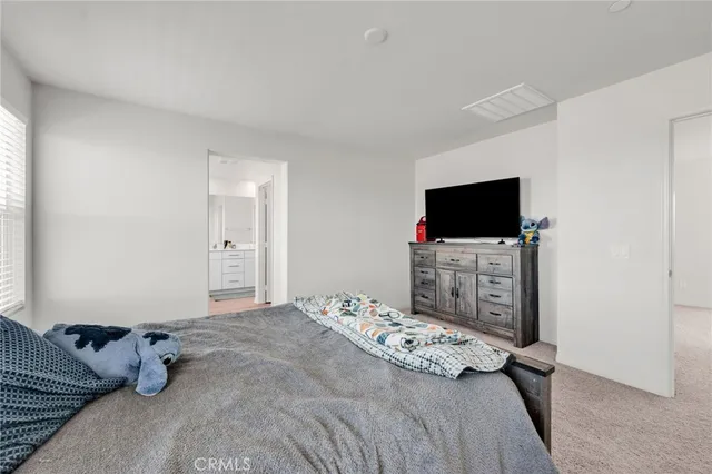 a en suite bathroom with a toilet shower and a sink