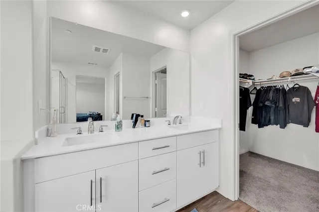 a bathroom with a sink toilet and a mirror