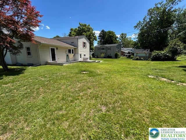 2065 Hopewell Road Bethlehem, PA 18017 - Photo 19 of 19 A spacious backyard with a verdant lawn, offering ample room for outdoor recreation and future enhancements.