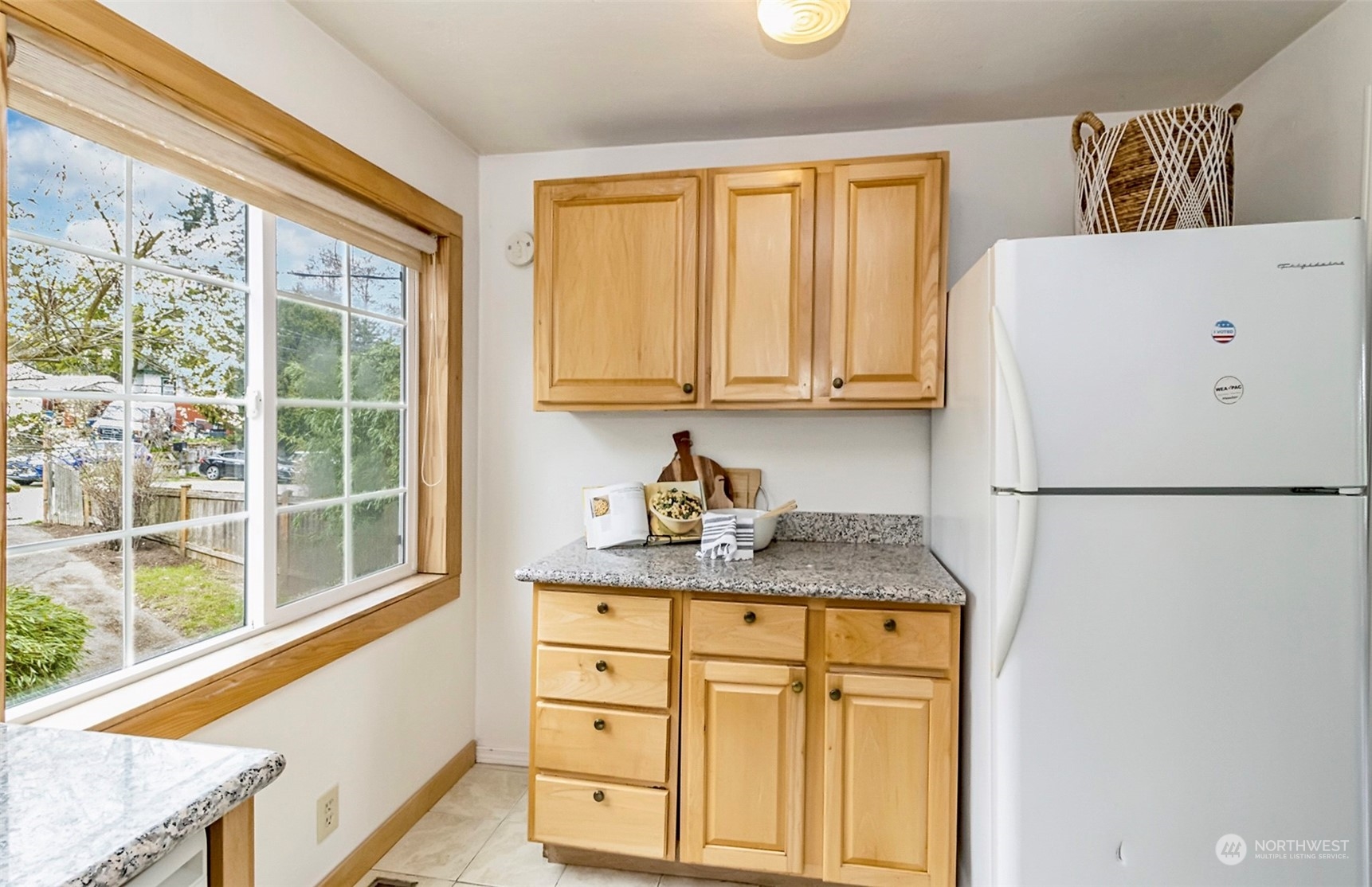 9048 3rd Avenue South Seattle, WA 98108 - Photo 15 of 36 a kitchen with a refrigerator a stove a sink a cabinets and a window