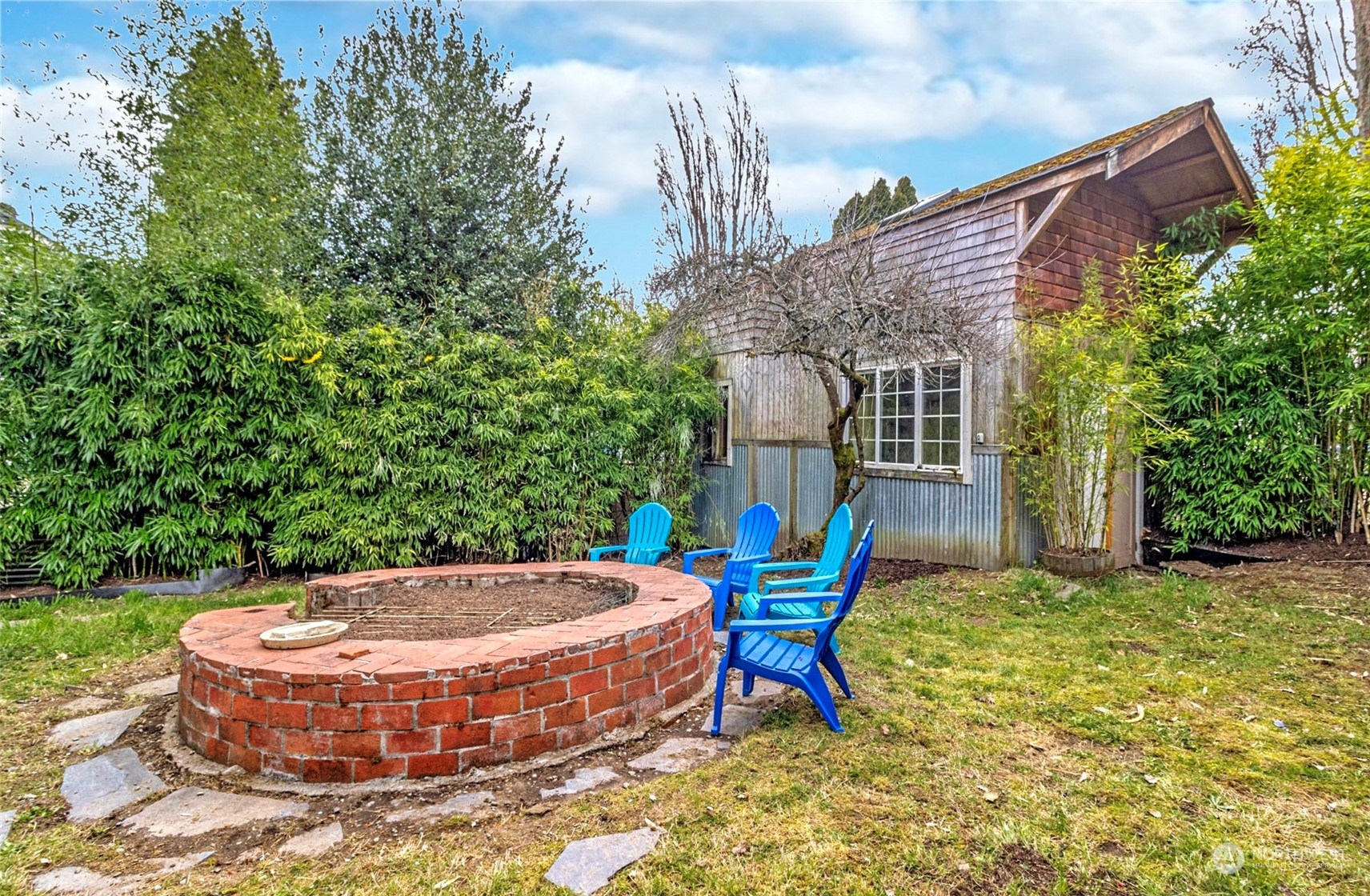 9048 3rd Avenue South Seattle, WA 98108 - Photo 23 of 36 a view of a chair and table in backyard