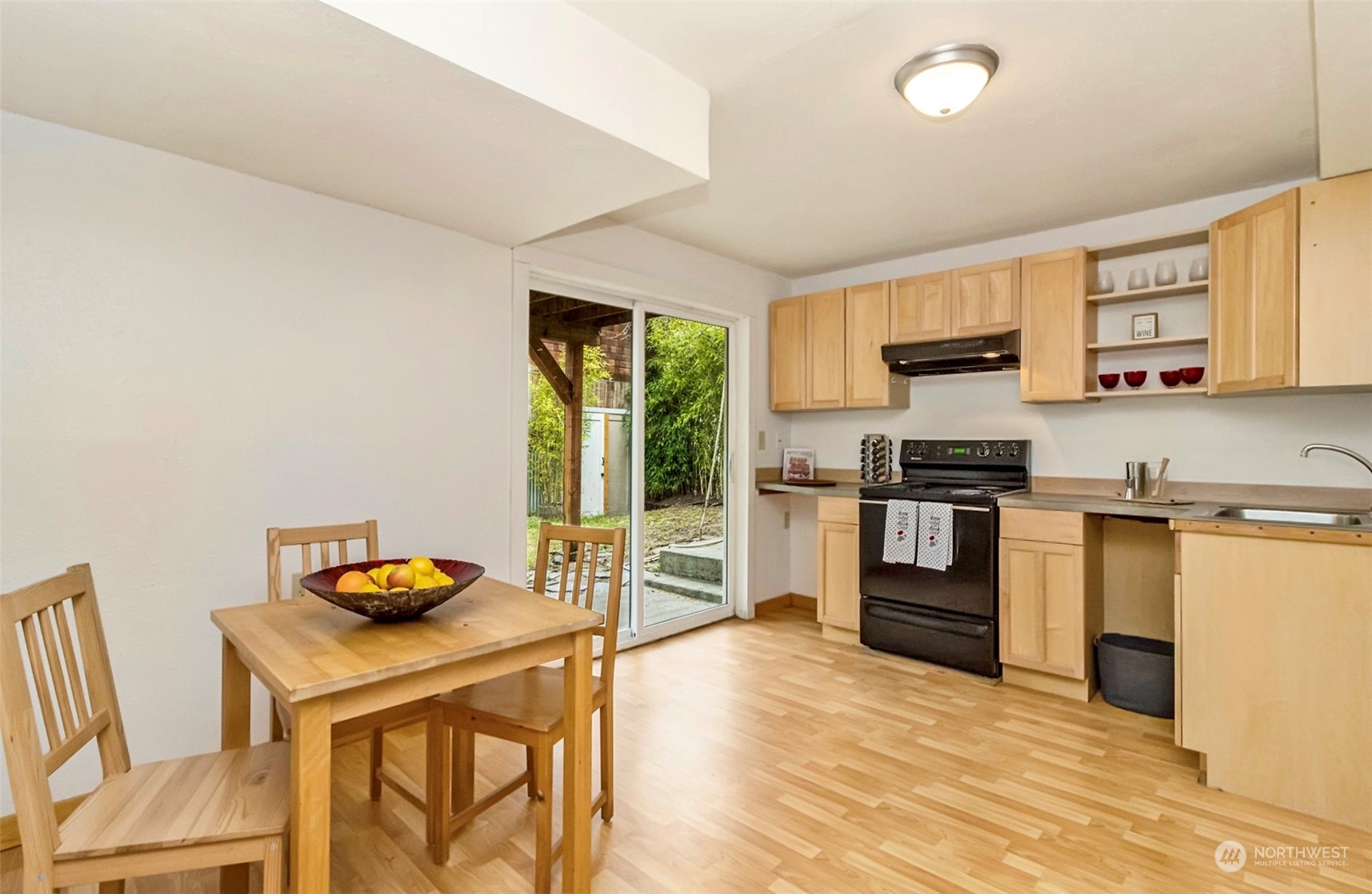 9048 3rd Avenue South Seattle, WA 98108 - Photo 25 of 36 a kitchen with stainless steel appliances kitchen island granite countertop a stove and a refrigerator