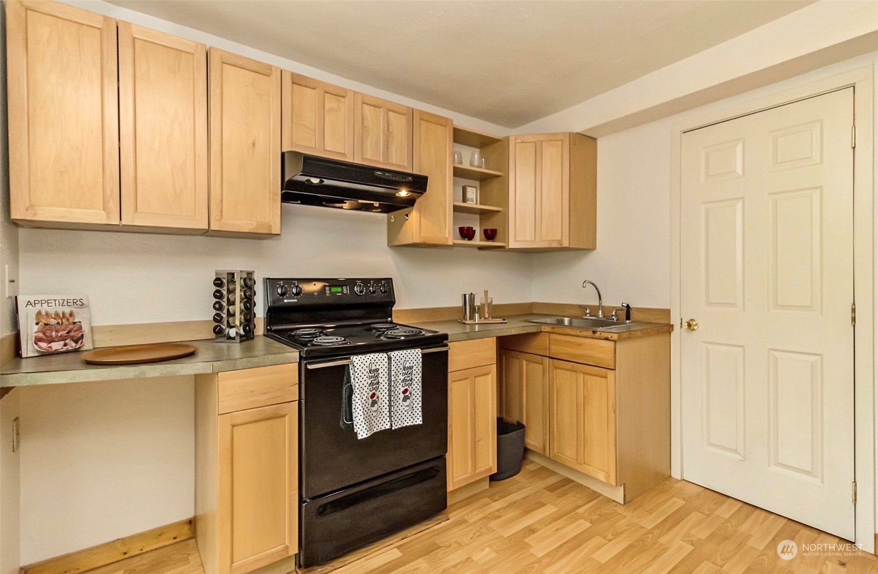 9048 3rd Avenue South Seattle, WA 98108 - Photo 26 of 36 a kitchen with stainless steel appliances granite countertop a stove and a refrigerator