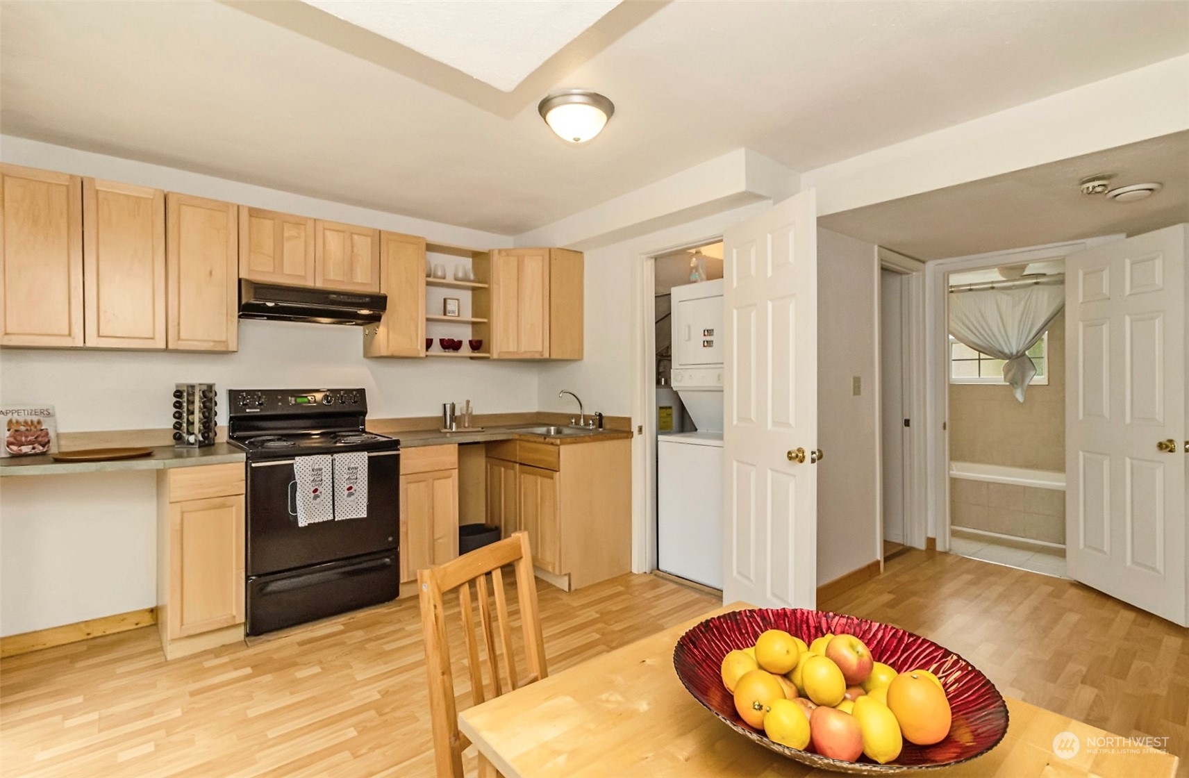 9048 3rd Avenue South Seattle, WA 98108 - Photo 28 of 36 a kitchen with a refrigerator and a stove top oven