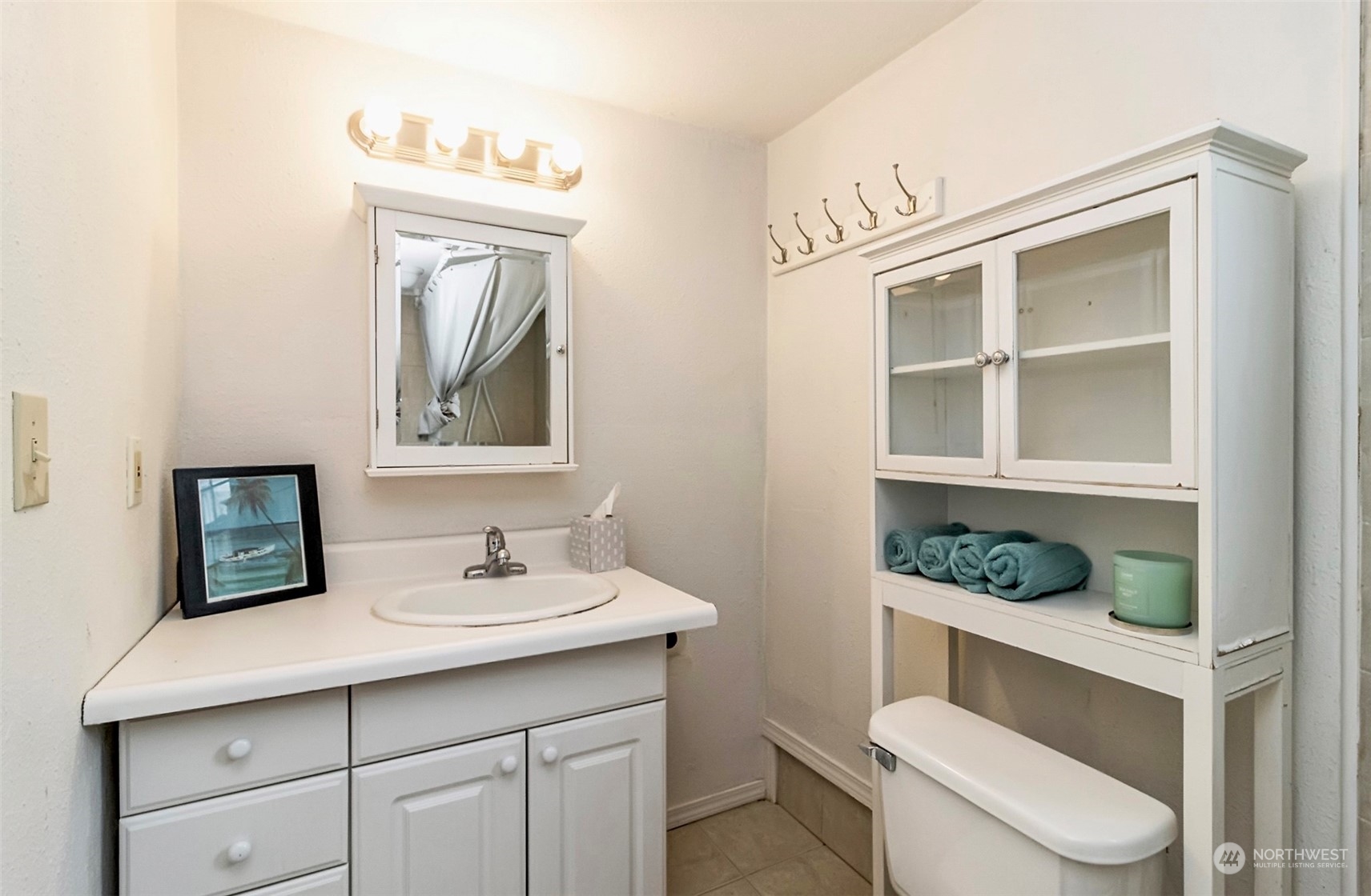 9048 3rd Avenue South Seattle, WA 98108 - Photo 32 of 36 a bathroom with a toilet sink and mirror