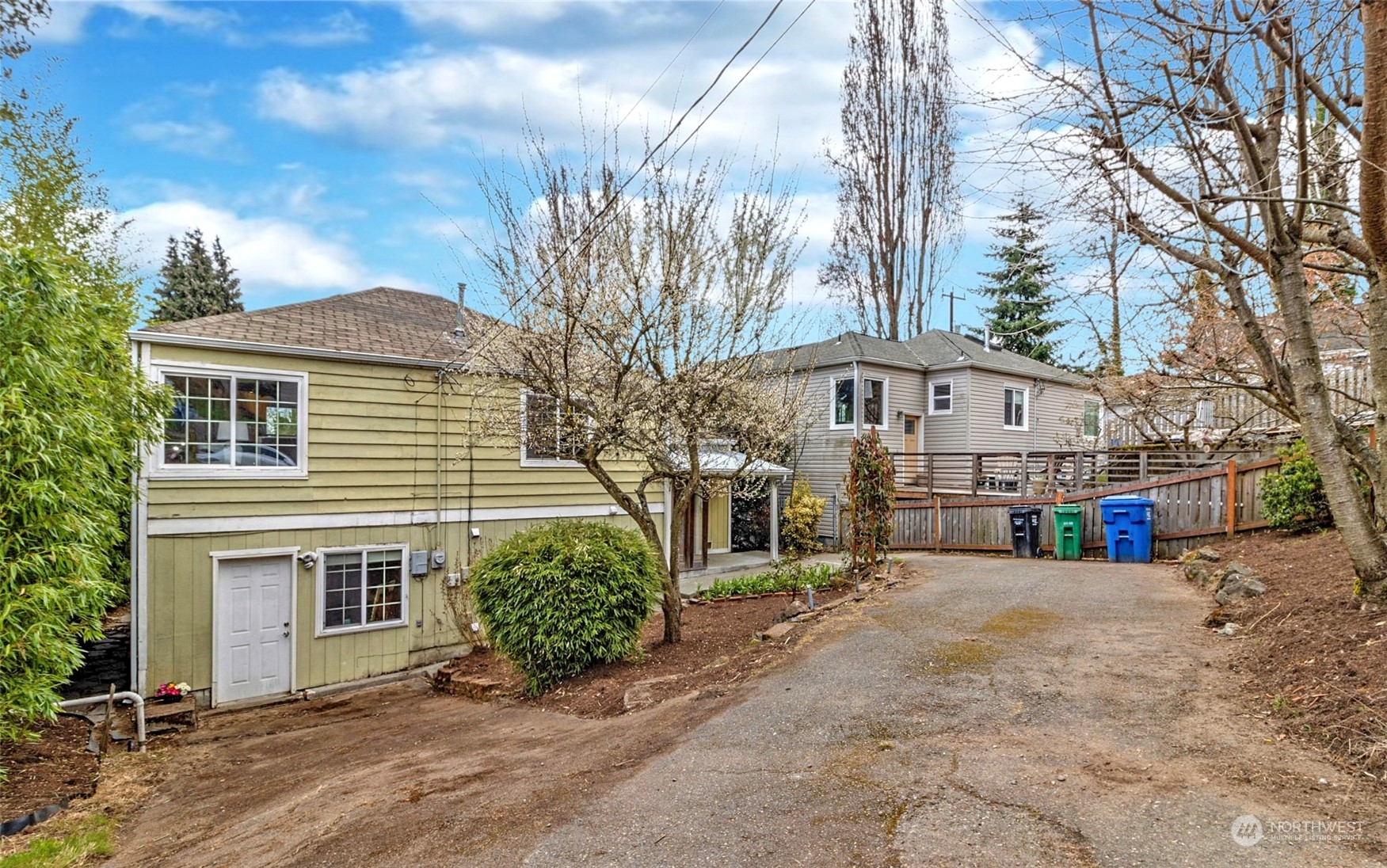 9048 3rd Avenue South Seattle, WA 98108 - Photo 36 of 36 a view of a house with a yard and potted plants