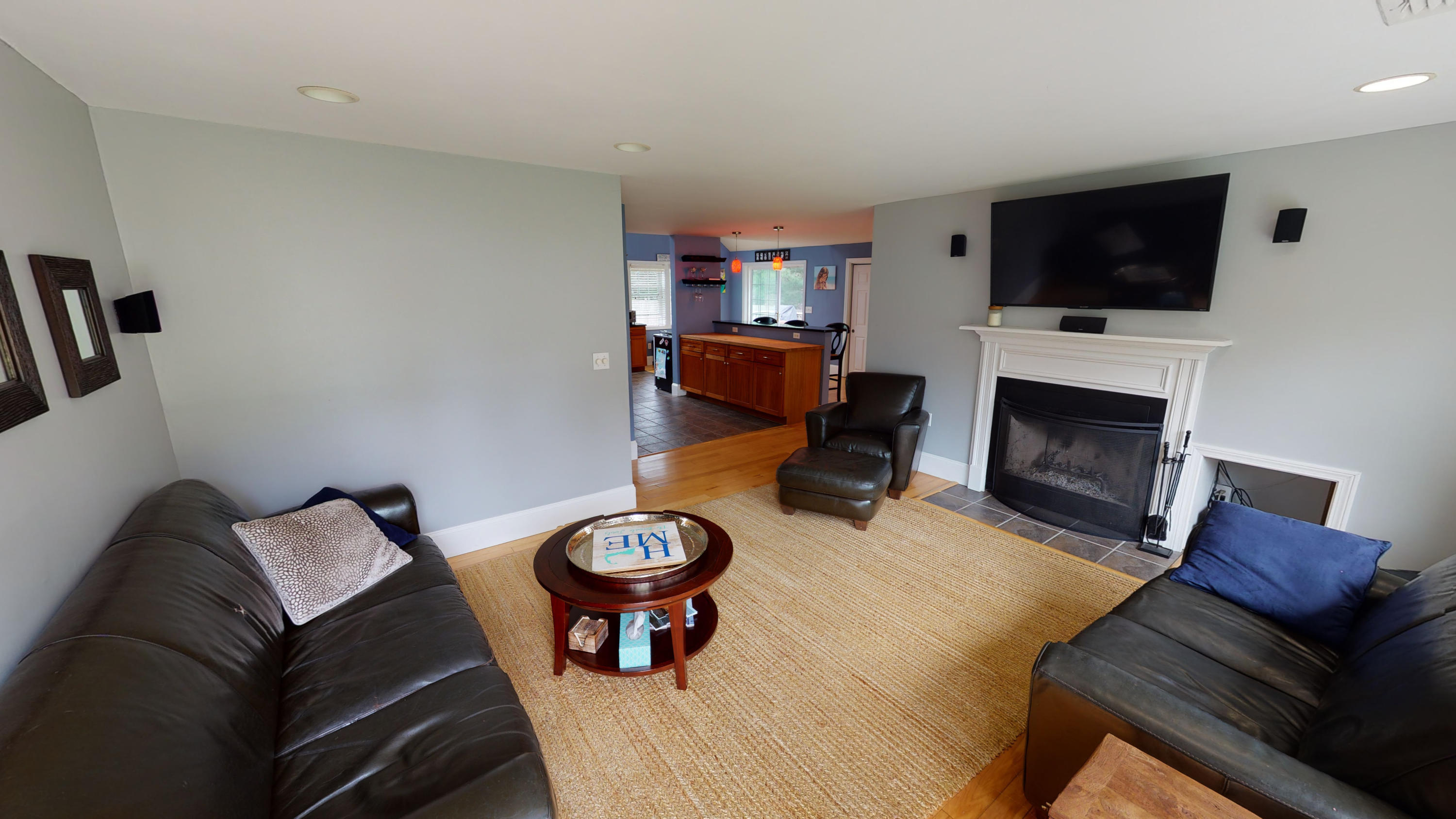 116 Oldham Road Osterville, MA 02655 - Photo 2 of 29 a living room with furniture and a fireplace or television
