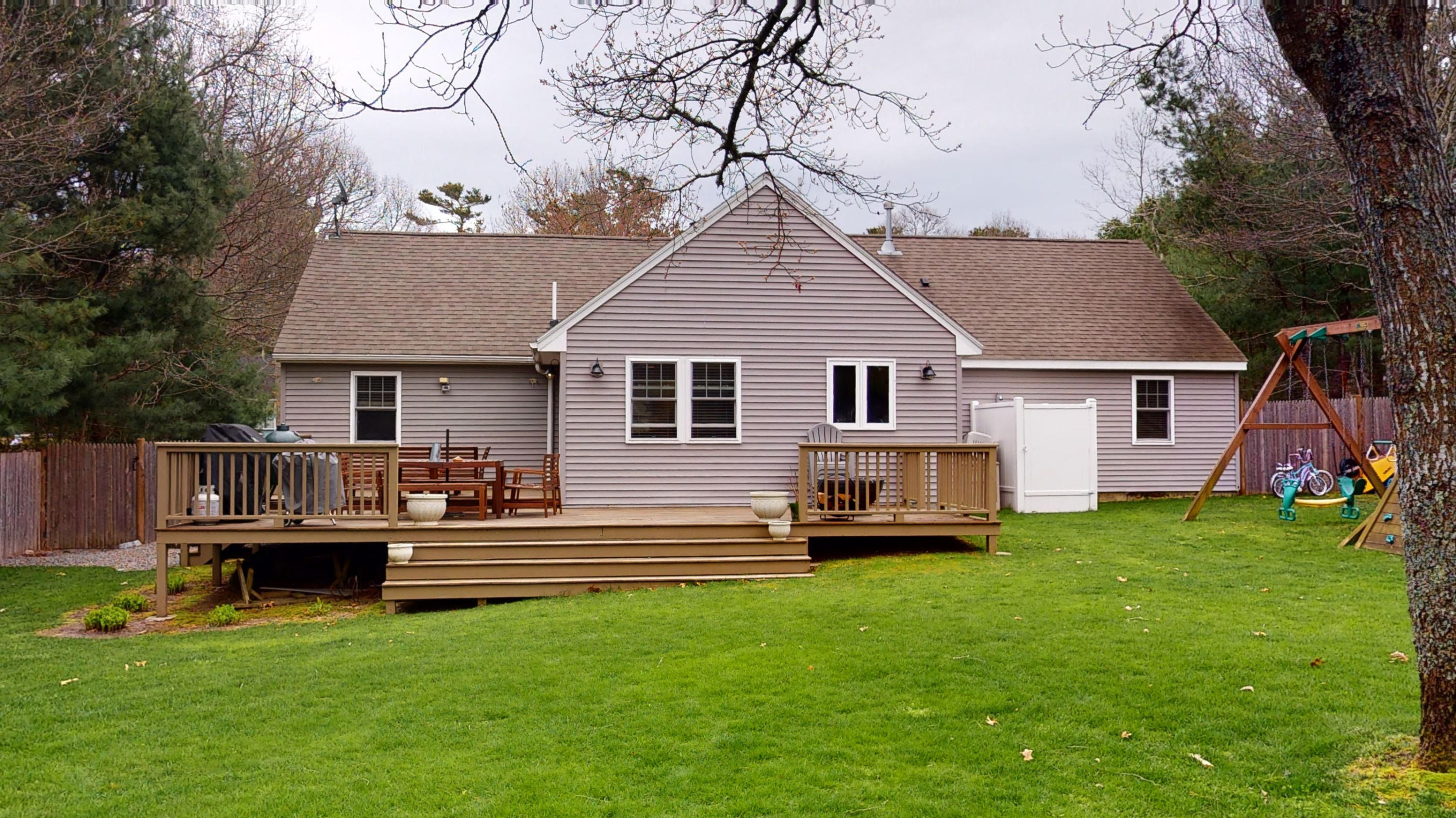 116 Oldham Road Osterville, MA 02655 - Photo 26 of 29 a front view of a house with a garden and trees