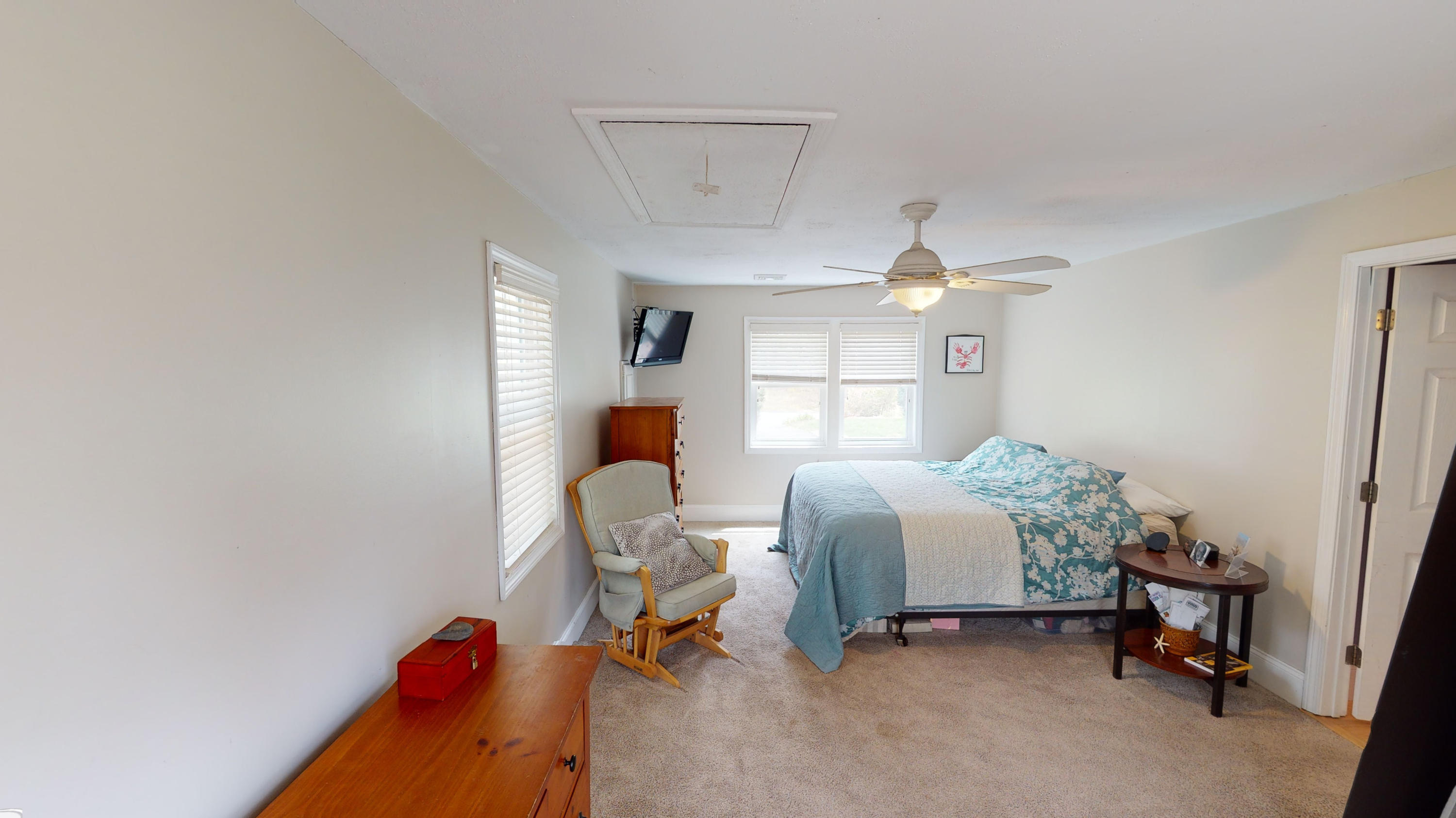 116 Oldham Road Osterville, MA 02655 - Photo 6 of 29 a bedroom with a bed and a chandelier fan