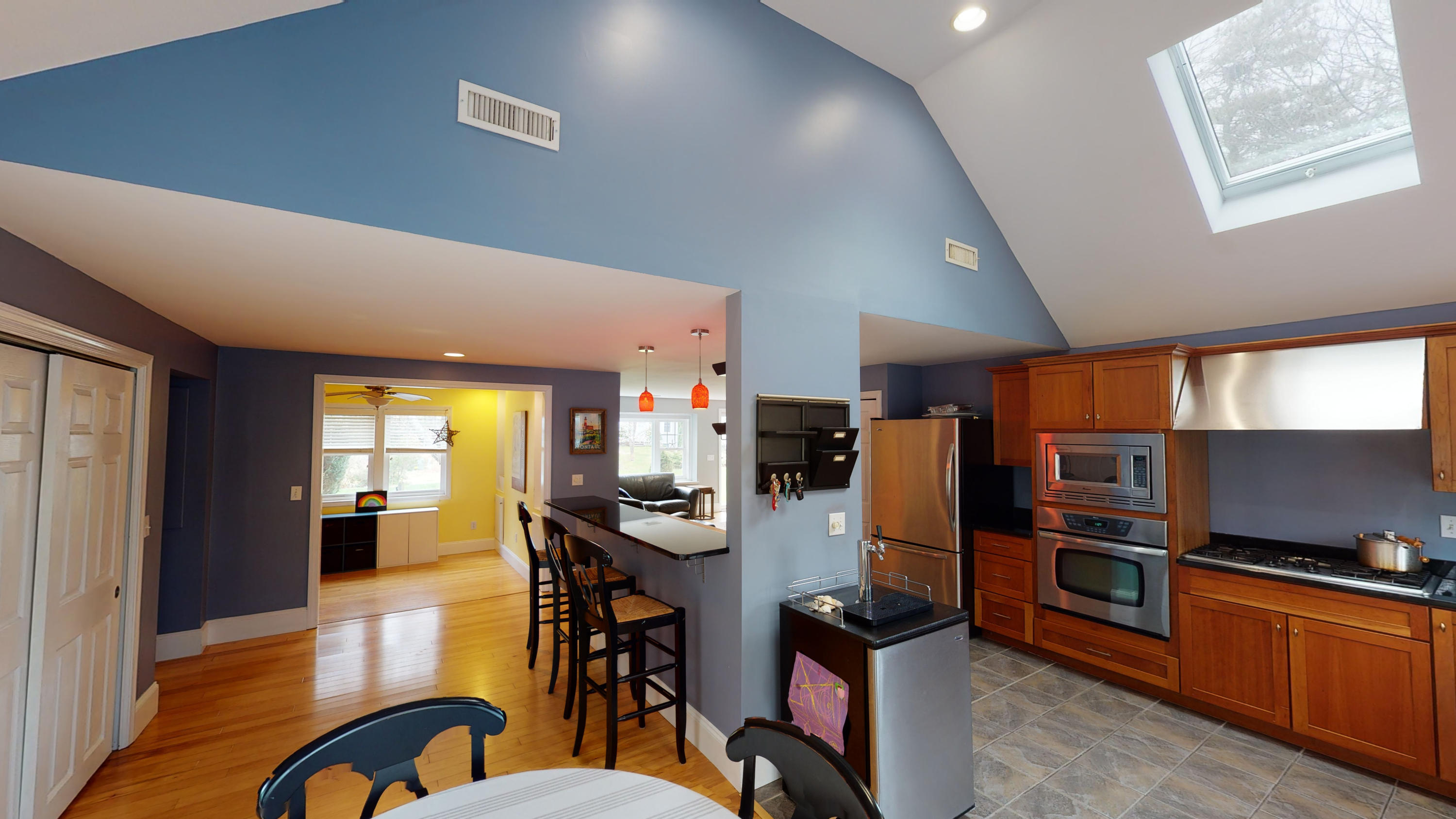 116 Oldham Road Osterville, MA 02655 - Photo 8 of 29 a kitchen with stainless steel appliances kitchen island granite countertop a refrigerator a stove top oven a sink dishwasher and white cabinets with wooden floor