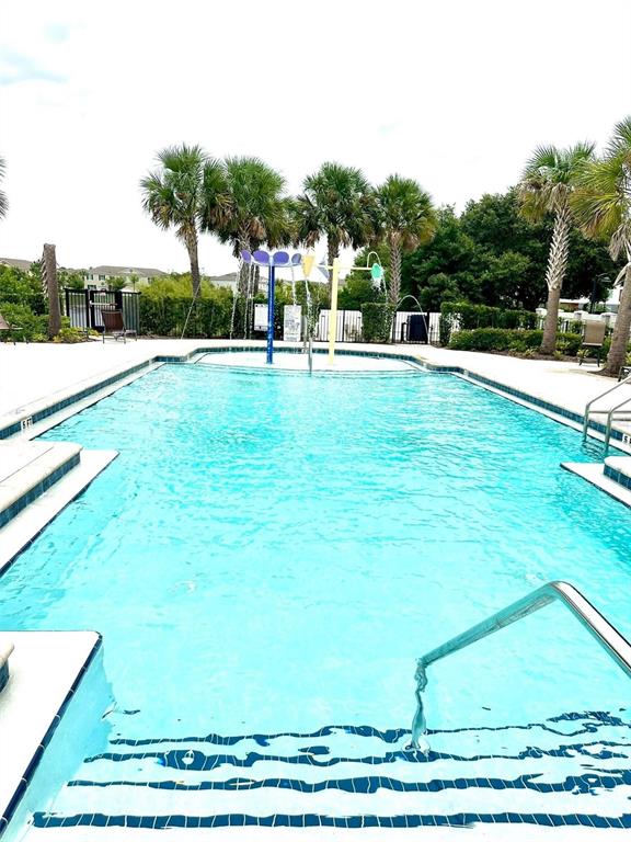 136 Villa Domani Circle Davenport, FL 33896 - Photo 9 of 9 a view of green field with house