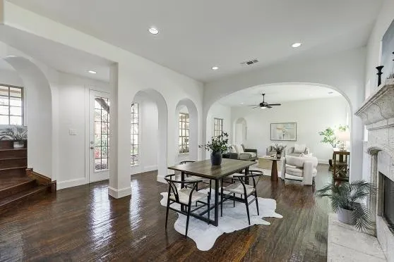 a view of a a dining room with furniture window and wooden floor