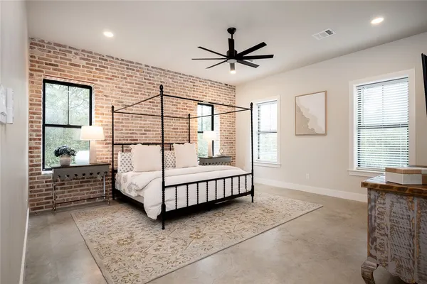 a bedroom with a bed and window