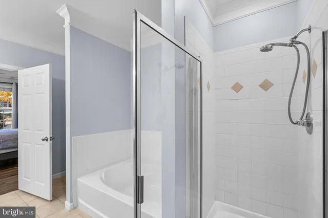 a bathroom with a shower and a bath tub