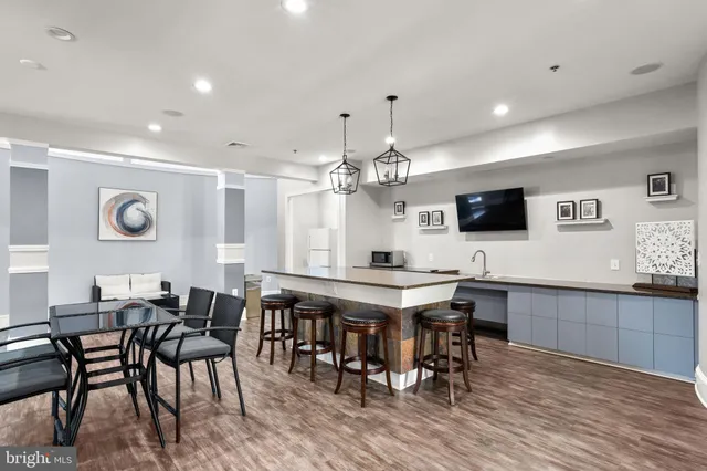 a view of a dining room with furniture and wooden floor