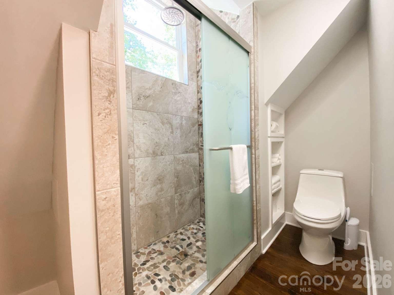 141 Carnegie Road Rutherfordton, NC 28139 - Photo 12 of 45 a bathroom with a toilet and a shower