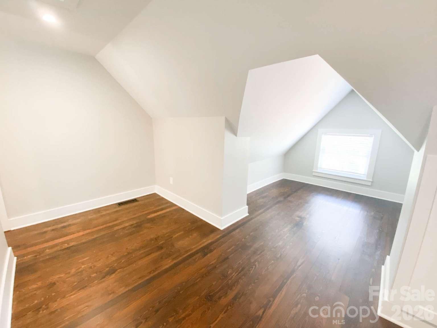 141 Carnegie Road Rutherfordton, NC 28139 - Photo 28 of 45 an empty room with wooden floor and windows