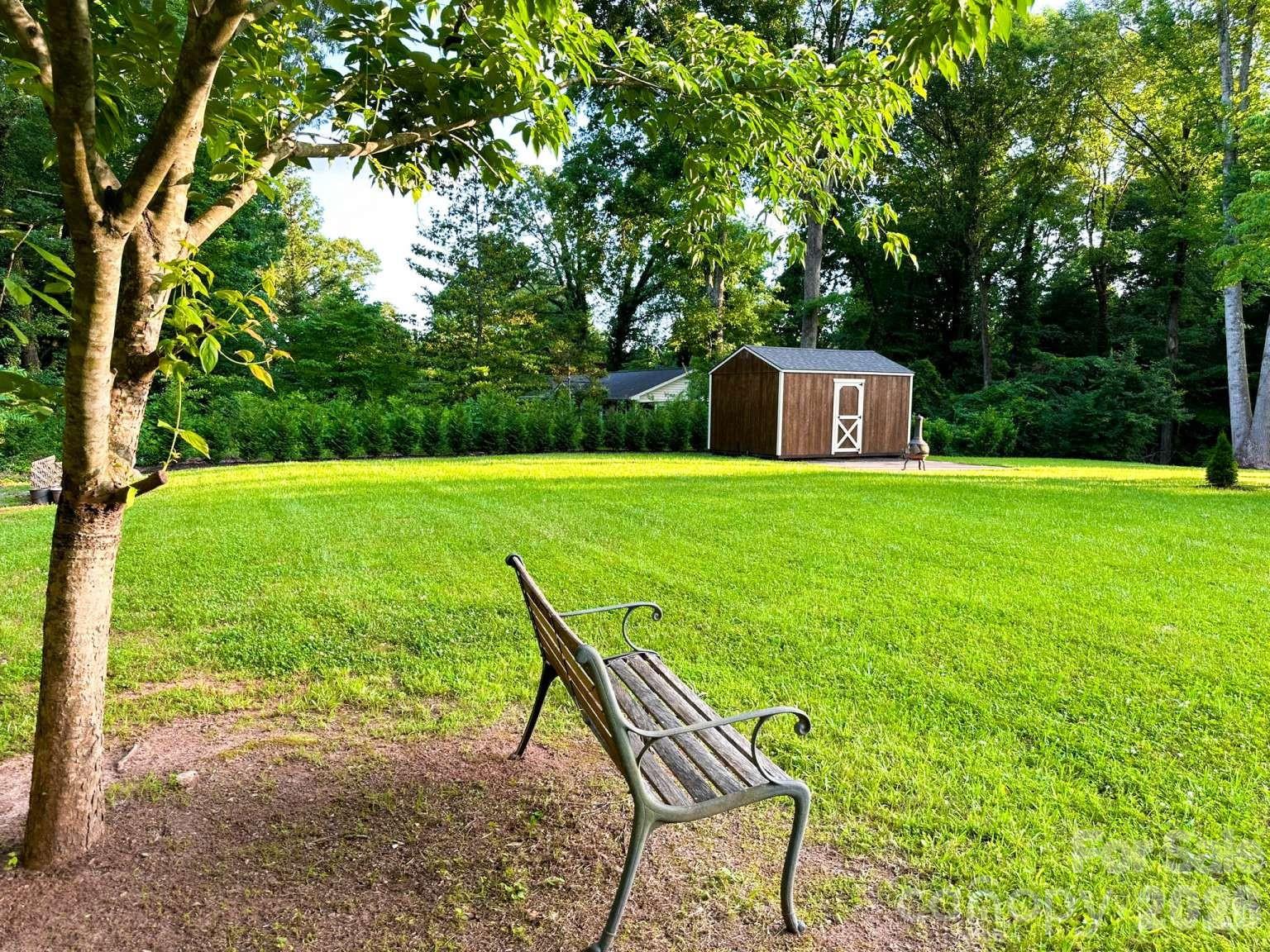 141 Carnegie Road Rutherfordton, NC 28139 - Photo 41 of 45 a view of a big yard with furniture and garden