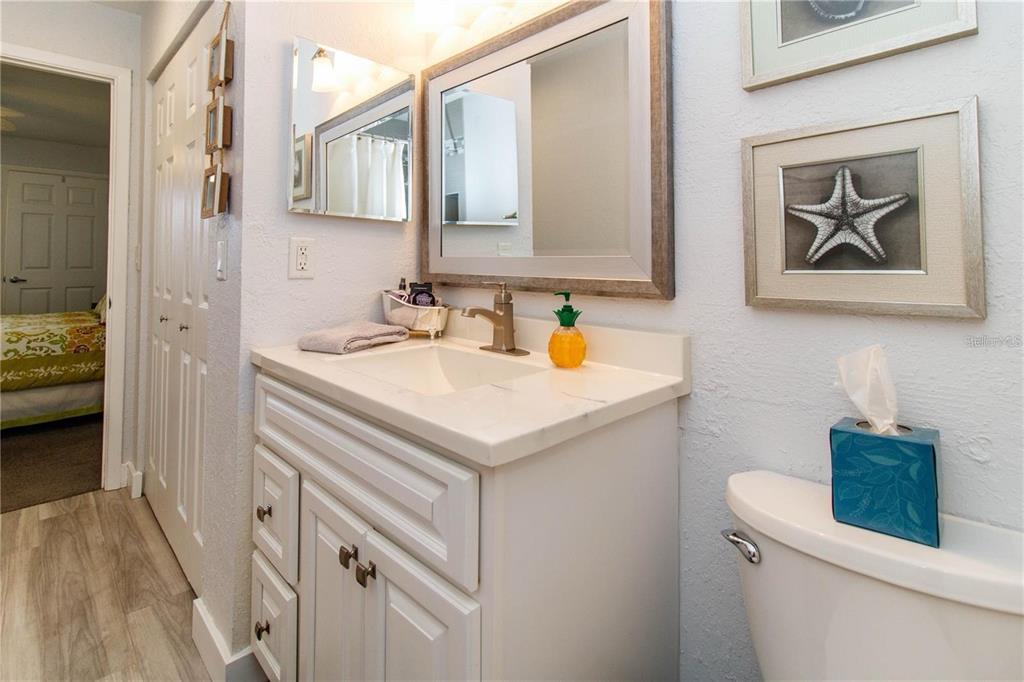 5135 Gemstone Drive, Unit 202 New Port Richey, FL 34652 - Photo 17 of 21 a bathroom with a sink and a mirror