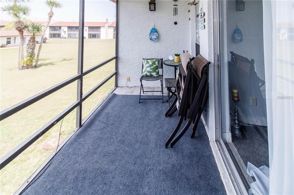 5135 Gemstone Drive, Unit 202 New Port Richey, FL 34652 - Photo 19 of 21 a view of a hallway with a dining room with stairs