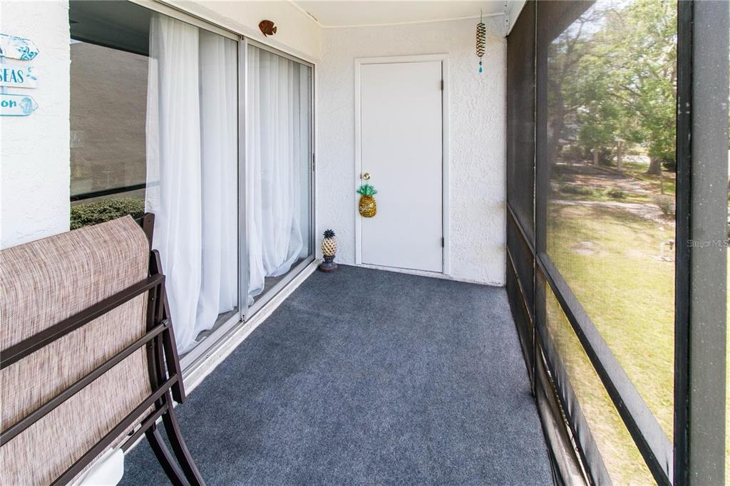 5135 Gemstone Drive, Unit 202 New Port Richey, FL 34652 - Photo 20 of 21 a view of an entryway with wooden floor