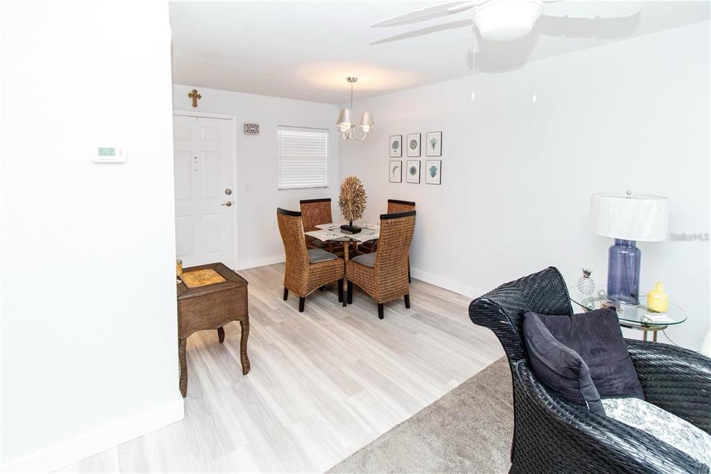 5135 Gemstone Drive, Unit 202 New Port Richey, FL 34652 - Photo 4 of 21 a workspace with furniture and a lamp