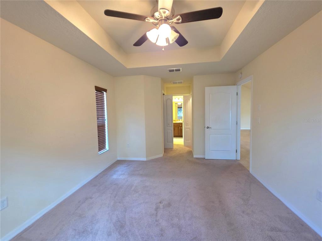 4284 High Ridge Avenue Spring Hill, FL 34609 - Photo 22 of 40 an empty room with closet and a chandelier fan