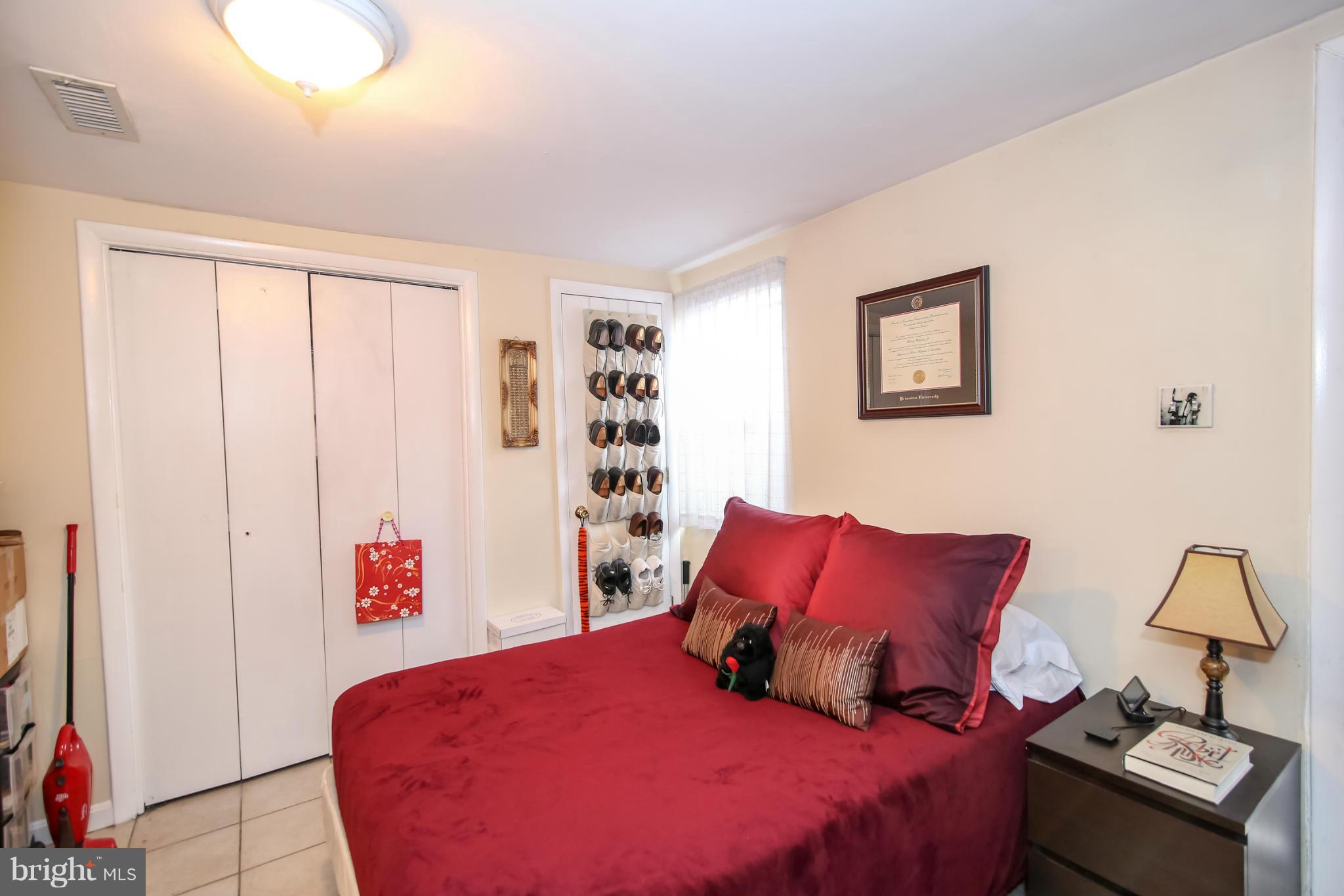 1608 4th Street Northwest Washington, DC 20001 - Photo 16 of 24 a bedroom with a bed and a night stand