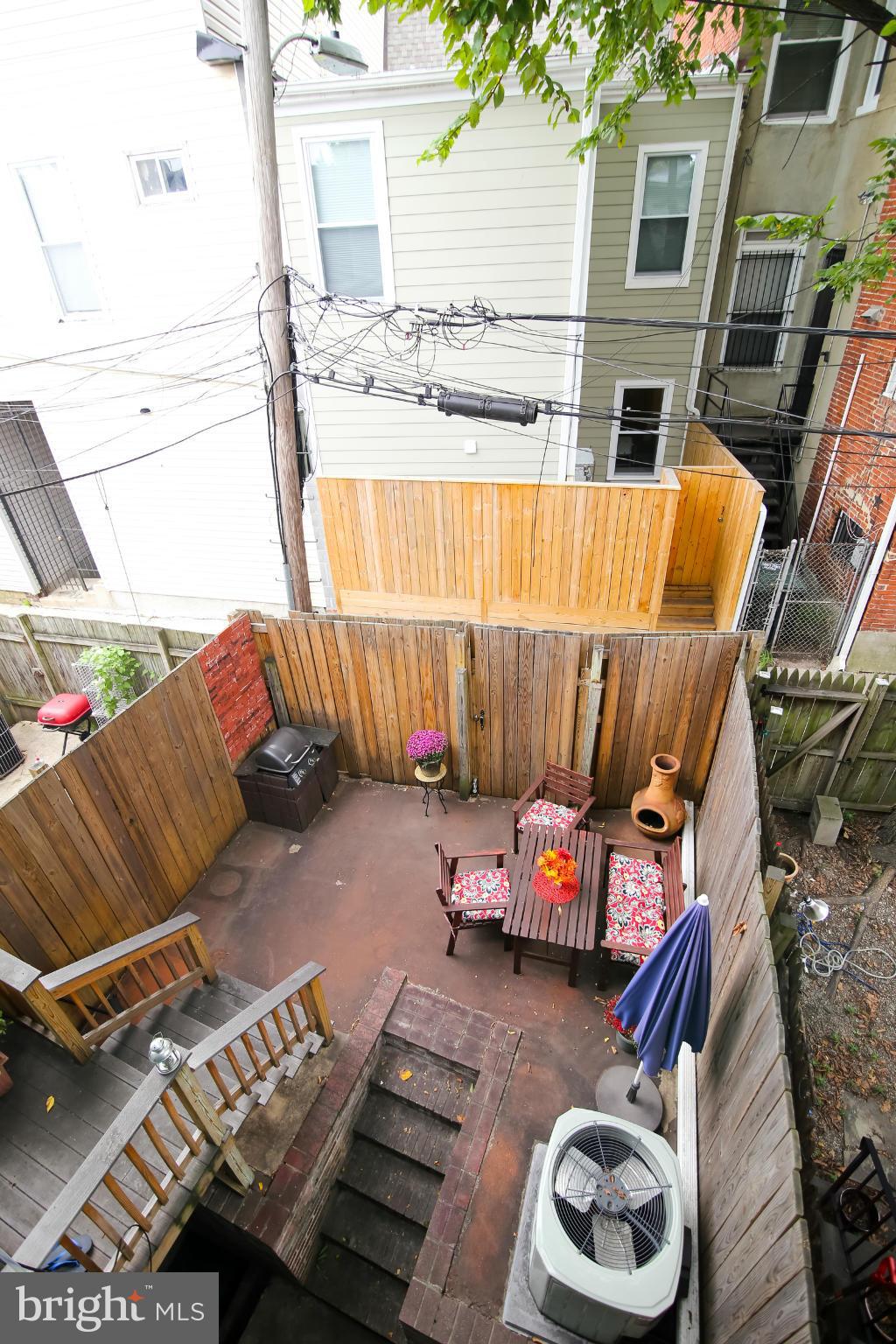 1608 4th Street Northwest Washington, DC 20001 - Photo 22 of 24 a backyard of a house with outdoor seating