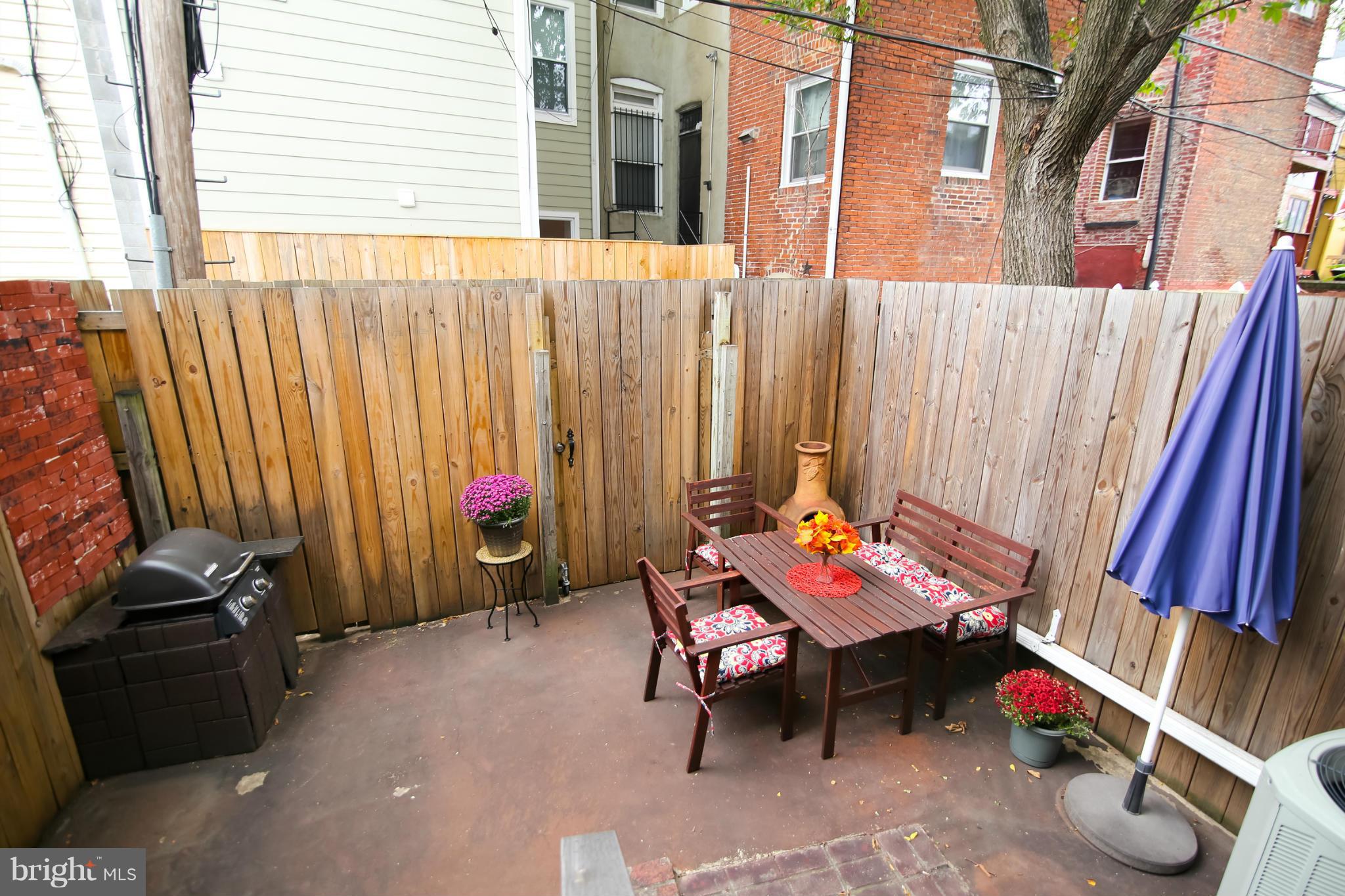 1608 4th Street Northwest Washington, DC 20001 - Photo 23 of 24 an outdoor sitting area with furniture and wooden floor