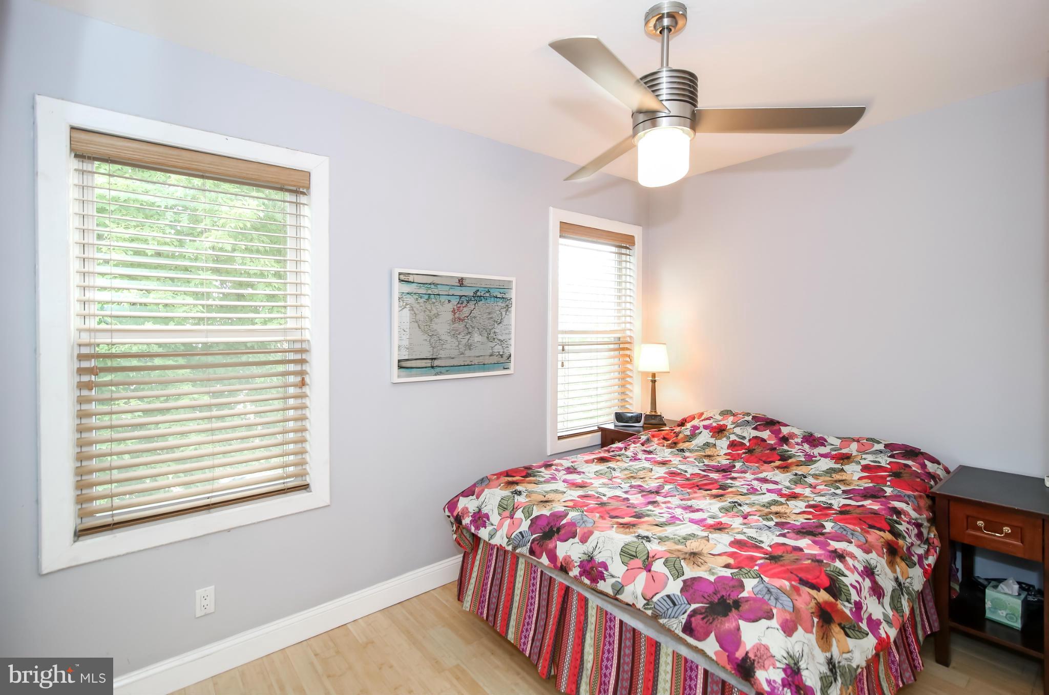 1608 4th Street Northwest Washington, DC 20001 - Photo 10 of 24 a bedroom with a bed and a chandelier