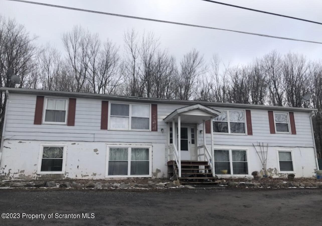 4441 Jubilee Road Moscow, PA 18444 - Photo 1 of 15 a front view of a house with a yard