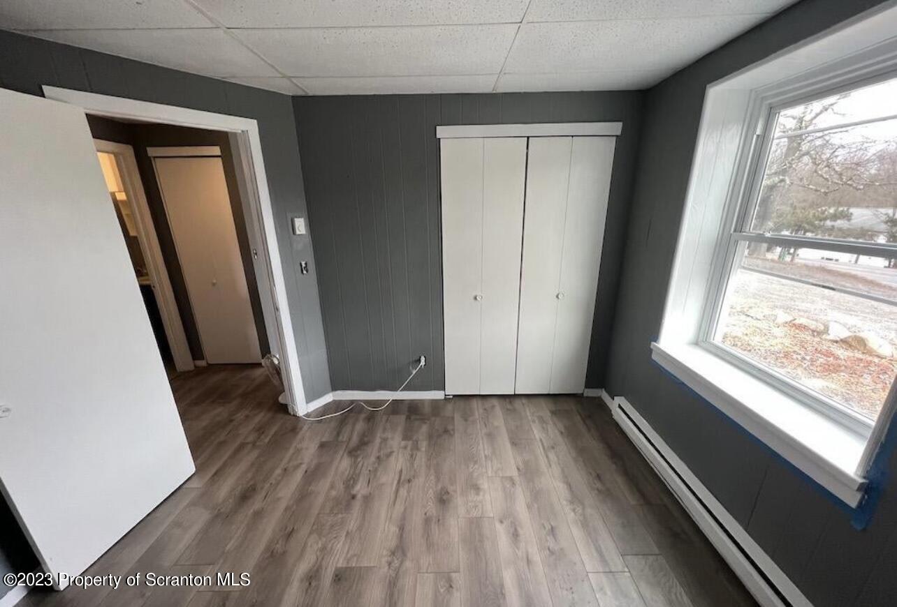 4441 Jubilee Road Moscow, PA 18444 - Photo 13 of 15 a view of a room with wooden floor and a window