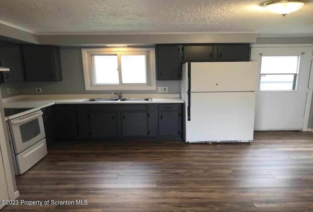 4441 Jubilee Road Moscow, PA 18444 - Photo 15 of 15 a kitchen with wooden cabinets and sink
