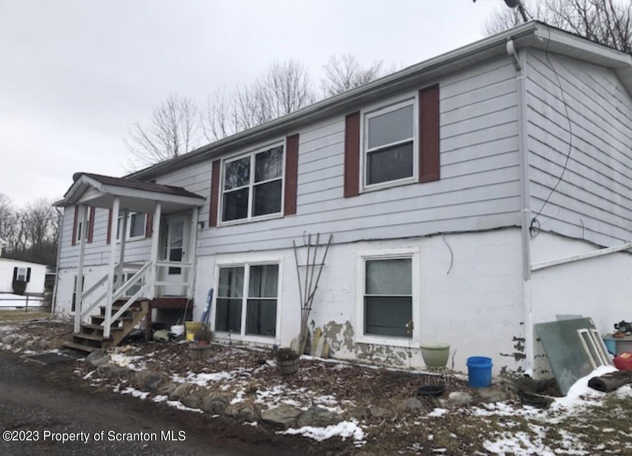 4441 Jubilee Road Moscow, PA 18444 - Photo 2 of 15 a front view of a house with a yard