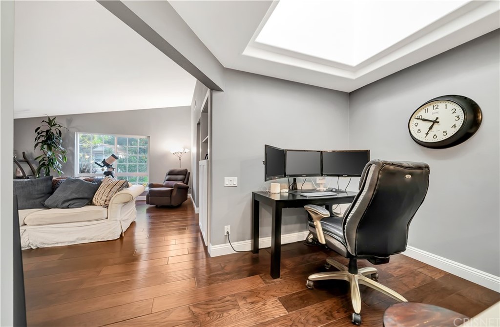 7078 Deveron Ridge Road West Hills, CA 91307 - Photo 15 of 62 a view of a livingroom with workspace and a couch