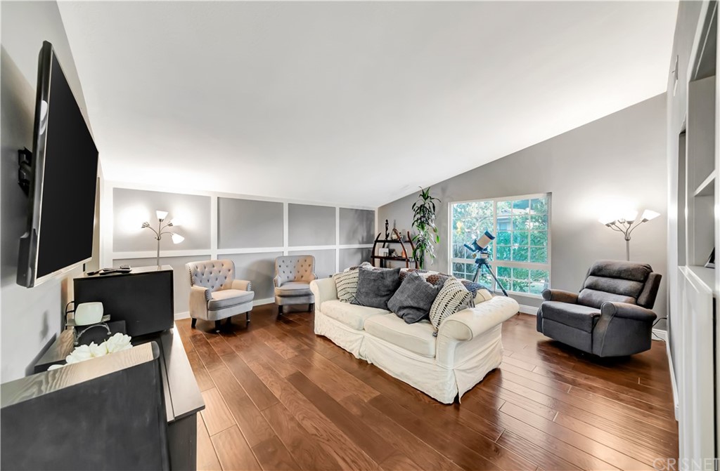 7078 Deveron Ridge Road West Hills, CA 91307 - Photo 17 of 62 a living room with furniture flat screen tv and window