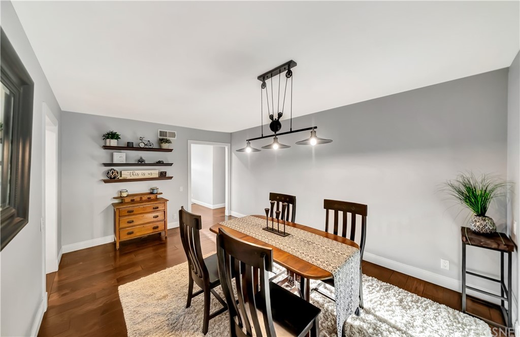 7078 Deveron Ridge Road West Hills, CA 91307 - Photo 20 of 62 a dining room with furniture and wooden floor