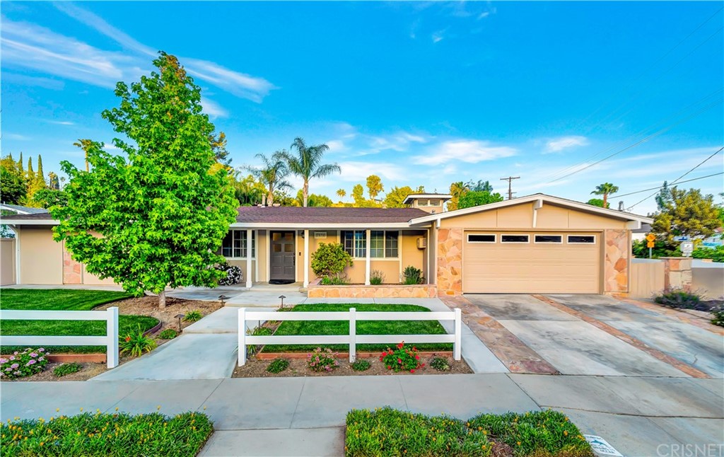7078 Deveron Ridge Road West Hills, CA 91307 - Photo 52 of 62 a front view of a house with a yard and garage