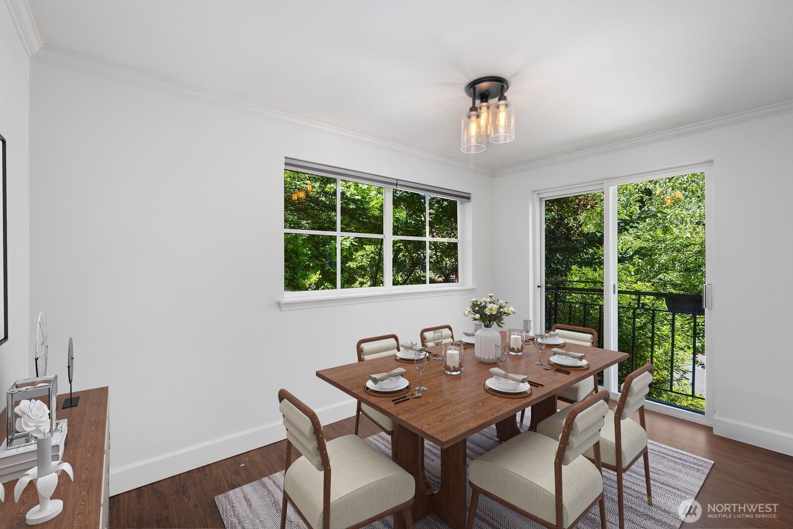 3901 Fremont Avenue North, Unit 202 Seattle, WA 98103 - Photo 10 of 23 a view of a dining room with furniture window and outside view