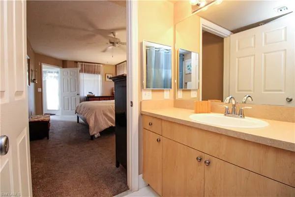 a en suite bathroom with a double sink and mirror