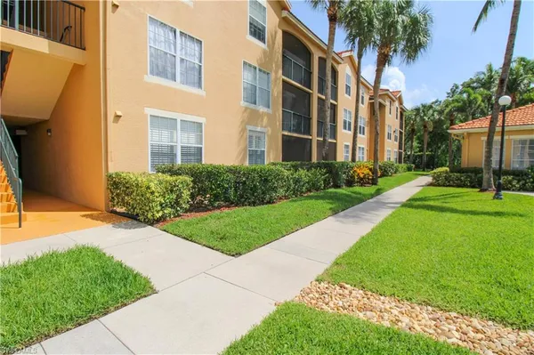 a view of a building with a yard