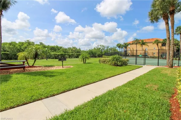 a view of a park with swings and slides