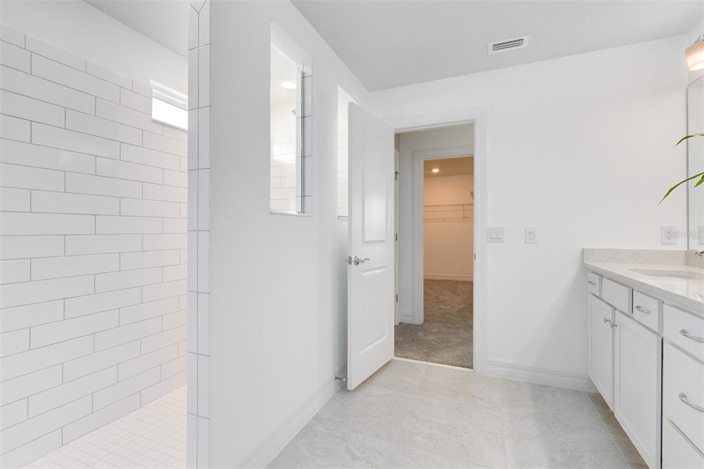 15130 Willow Ridge Drive Montverde, FL 34756 - Photo 19 of 27 a view of a bathroom cabinets and a bathroom