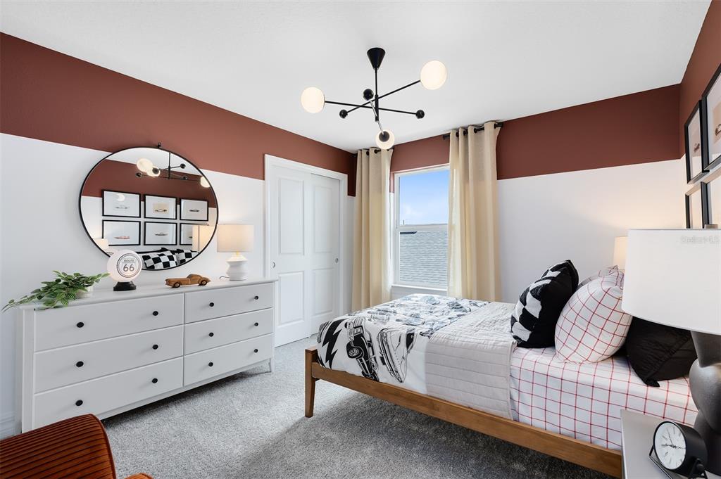 15130 Willow Ridge Drive Montverde, FL 34756 - Photo 24 of 27 a bedroom with a bed and a dresser