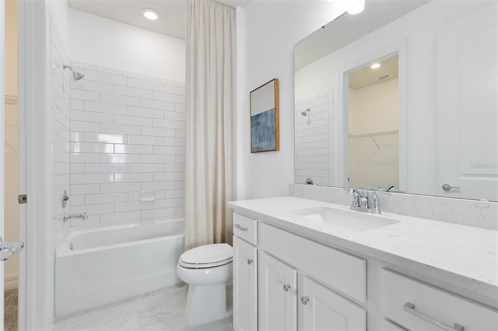 15130 Willow Ridge Drive Montverde, FL 34756 - Photo 25 of 27 a bathroom with a sink a toilet and shower
