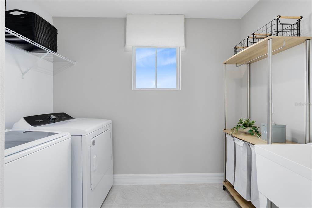 15130 Willow Ridge Drive Montverde, FL 34756 - Photo 26 of 27 a utility room with dryer and washer