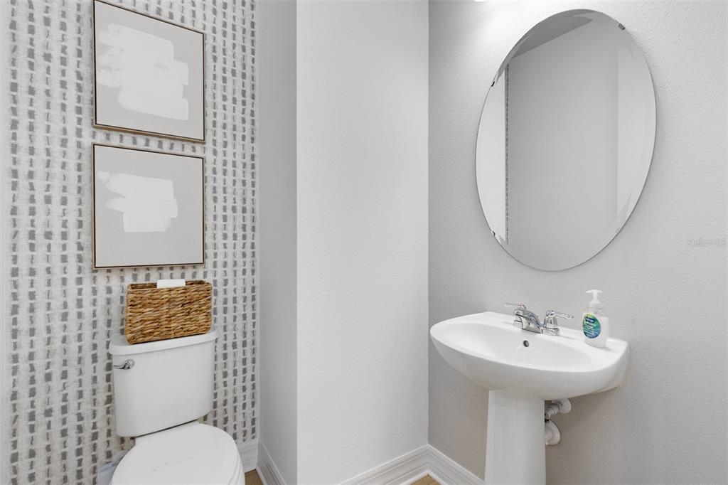15130 Willow Ridge Drive Montverde, FL 34756 - Photo 27 of 27 a bathroom with a toilet sink and mirror
