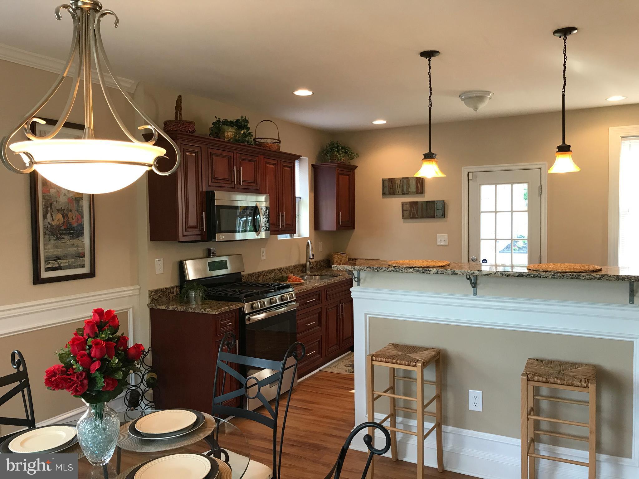 3905 Ridgecroft Road Baltimore, MD 21206 - Photo 5 of 30 Kitchen - breakfast bar with pendant lights